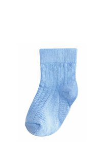 Chaussette pour bébé bleu clair côtelée avec un bord replié, présentée sur un fond blanc.