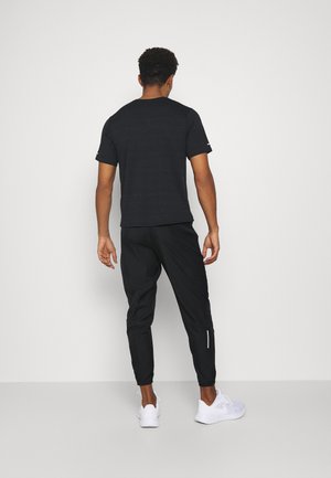 ESSENTIAL PANT - Jogginghose - black/reflective silver