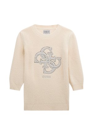 Pull à manches longues couleur crème avec poignets côtelés et logo GUESS en lettres métalliques superposées sur la poitrine.
