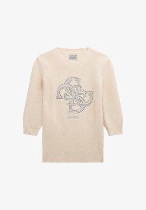 Pull à manches longues couleur crème avec poignets côtelés et logo GUESS en lettres métalliques superposées sur la poitrine.