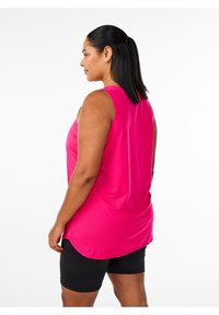 Fuchsia sleeveless top with a flowy design and rounded hem, paired with black athletic shorts. Smooth texture, no visible patterns.