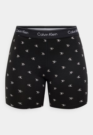 Black cotton boxer shorts featuring a repeating CK logo pattern in light gray. Elastic waistband with "Calvin Klein" printed in white.