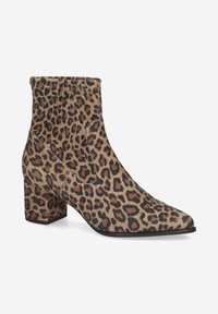 Bottines en imprimé léopard avec un bout pointu, un talon carré épais et une texture de tissu douce. Équipées d'un élastique sur le côté pour un enfilage facile.