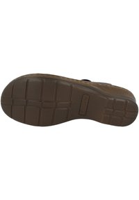 Suola di sandalini in gomma marrone con un motivo di battistrada testurizzato, caratterizzato da una griglia rettangolare per la trazione e un'etichetta del marchio stampata sul lato.