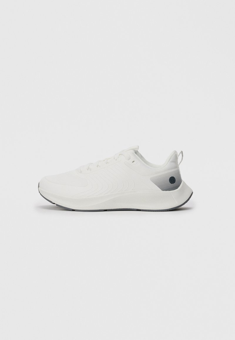 White athletic sneaker with lace-up design, textured sole, and black logo detail on heel, shown in side profile on white background.