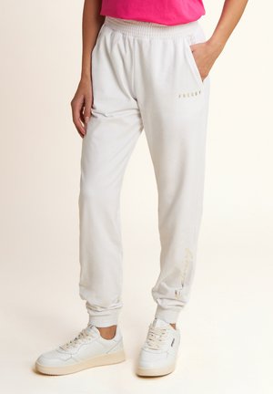 CON ELASTICO SUL E DETTAGLI FLOREALI - Pantalones deportivos - bianco