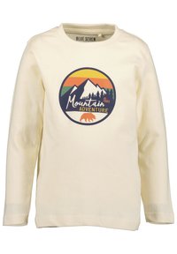 Cremfarbendes Langarm-T-Shirt mit einem kreisförmigen Grafikdesign, das Berge, Bäume und ein Bärenlogo in blau, orange und grün zeigt.