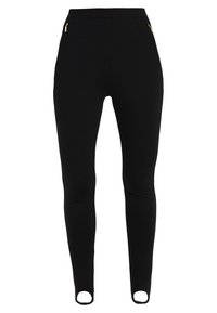 Svarta leggings med en åtsittande design, elastisk midja, två sidofickor med dragkedja och utskurna detaljer vid anklarna för extra stil.