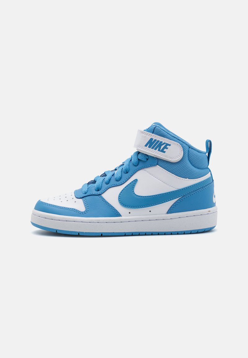 High-top Nike sneaker with a predominantly white upper and blue accents. Features a mesh tongue, lace closure, and Velcro strap for support.