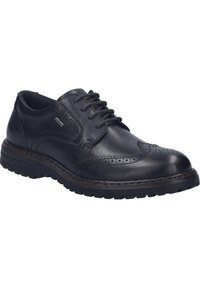 Scarpe stringate in pelle nera con dettagli brogue, punta rotonda e suola in gomma. Presentano accenti cuciti e una finitura textured.