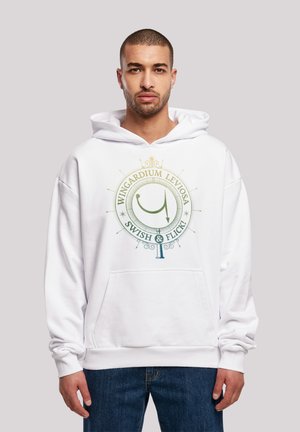 White hoodie featuring a circular logo with “Wingardium Leviosa” and “Swish & Flick!” in green and gold. Front kangaroo pocket included.