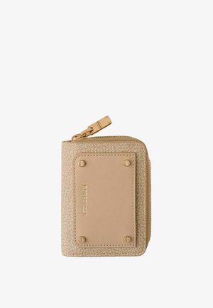 Compact beige wallet with textured fabric, rectangular leather patch secured by four rivets, and gold zipper pull tab.