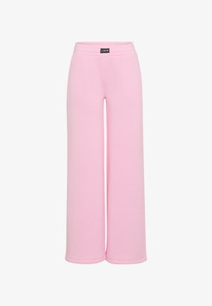 Roze wijde broek met elastische tailleband en een klein zwart rechthoekig LSCN-logo op de voorkant in het midden.