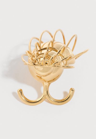 Χρυσό μεταλλικό κλιπ για τα μαλλιά με πολλαπλές καμπυλωτές ακίδες και διπλή βάση αγκίστρου σε λευκό φόντο.