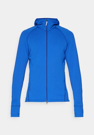 Blue athletic zip-up hoodie with a fitted design, long sleeves, raglan style, and a hood. Features side zip pockets and ribbed cuffs.