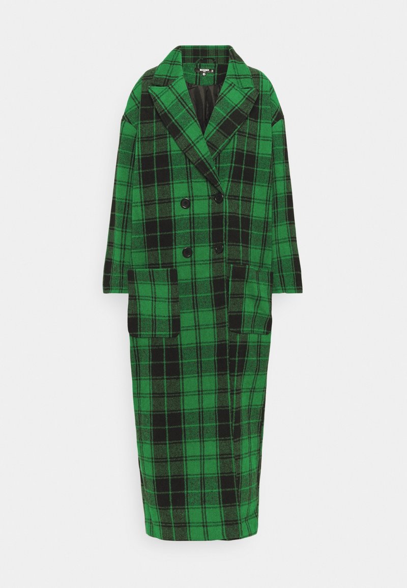 Long manteau croisé à carreaux verts et noirs avec larges revers et deux grandes poches avant, présenté à plat sur fond blanc.