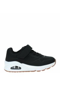 Zapatilla deportiva negra con parte superior de malla, cuello acolchado, correa ajustable y entresuela blanca. Presenta una unidad de amortiguación de aire visible y suela de goma.