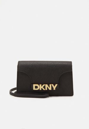 Black crossbody bag made of textured material, featuring a gold DKNY logo, structured flap design, and adjustable strap.