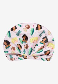 Bonnet de douche imprimé avec des visages de femmes de style cartoon et des motifs de feuilles vertes sur un fond rose. Le matériau est lisse avec une finition légèrement brillante.