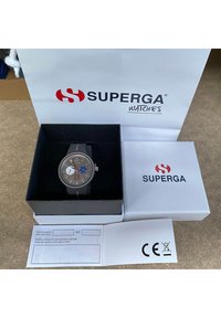 Superga watch with a grey face, black strap, red and blue accents, displayed in a black box with a white lid and branded packaging.