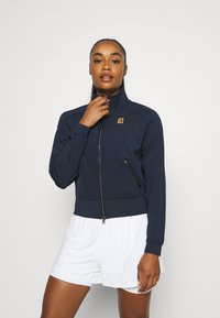 Nike Performance HERITAGE JACKET - Casaco de treino - obsidian/white