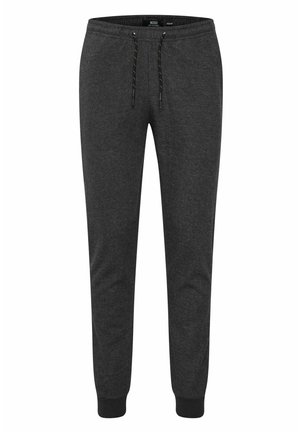 Gray sweatpants made of cotton blend, featuring an elastic waistband, drawstring, and fitted cuffs at the ankles. Smooth texture.