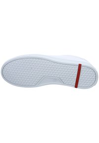 Semelle de sneaker blanche avec un design texturé, comportant un accent rouge. Inclut un marquage de taille "42" et un motif de grip en caoutchouc contrastant.