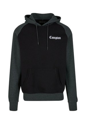 Black and dark grey hoodie with a front pocket, drawstring hood, and "Compton" text in white on the chest. Cotton blend fabric, casual design.