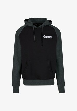 Musta- ja tummanharmaa huppari, jossa on etutasku, naruhuppu ja valkoiset "Compton"-tekstit rinnassa. Puuvillasekoitekangas, rento muotoilu.