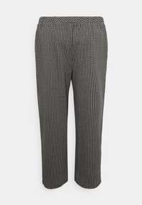 Calças com padrão pied-de-poule em preto e branco, com um corte descontraído, cintura elástica e textura suave ao toque. Design até ao tornozelo.