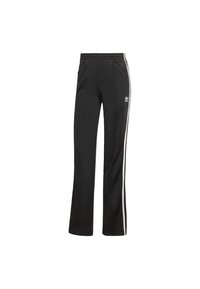 Pantalones deportivos negros con un corte relajado, que cuentan con rayas laterales blancas, una cintura elástica y un detalle de logo en el lado izquierdo.