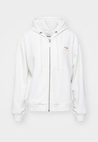 White zip-up hoodie made of soft material, featuring a drawstring hood and logo in pastel colors on the left side. Ribbed cuffs and hem.