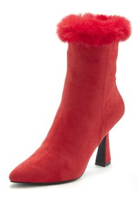 Red suede ankle boot with a pointed toe, a fuzzy red fur cuff, and a black stiletto heel. Smooth texture and sleek design.