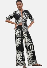 Lipsy PRINTED WIDE  - Nadrágok - black