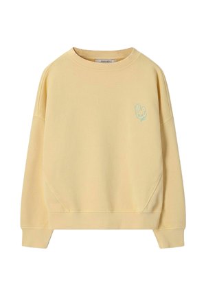 Sweat-shirt jaune clair à col rond avec manches longues et petit motif main bleu sur le côté gauche de la poitrine.