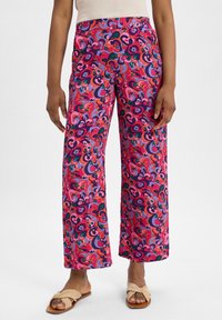 Brightly patterned wide-leg pants featuring swirls of pink, purple, and green on a vibrant background, made from lightweight fabric.