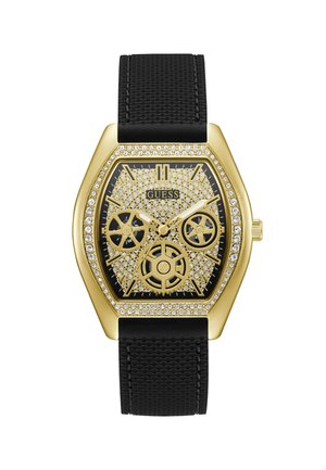 Goudkleurig hexagonaal horloge met een zwarte gestructureerde band. Voorzien van een bezel bezet met kristallen, een ingewikkeld tandwielontwerp op de wijzerplaat en witte wijzers.