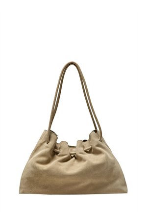 Soft beige suede shoulder bag with long double straps and a gathered top design without visible closures.