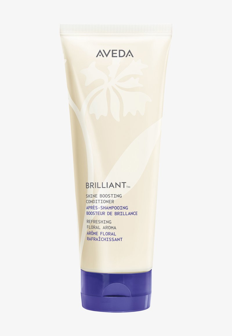 Tube de conditionneur Aveda Brilliant Shine Boosting avec bouchon violet, étiqueté pour la brillance, arôme floral et parfum rafraîchissant.