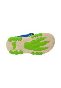 Sole della scarpa con una base beige texturizzata, caratterizzata da cuscinetti di grip in gomma verde e un design a forma di piede. Materiale superiore blu visibile nella parte superiore.
