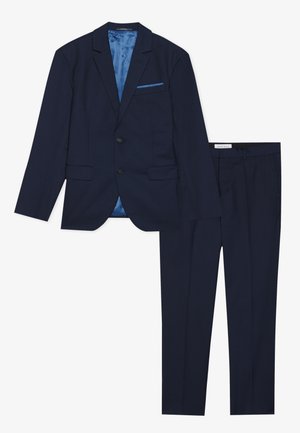 Marineblaues Anzug mit einem einreihigen Blazer mit Revers und einem kontrastierenden blauen Futter, kombiniert mit maßgeschneiderten Hosen.