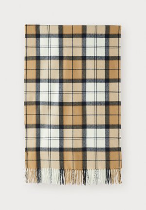 Tan, black, and white plaid scarf with fringed ends, laid flat on a white background.