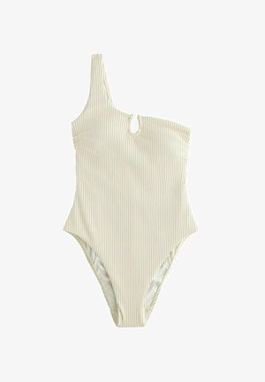 Jednobarevné béžové jednodílné plavky s jedním ramenem, žebrované, s malým průstřihem vpředu a vysokými rozparky u nohou.