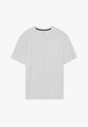 T-shirt gris clair en tissu doux, avec des manches courtes, un col rond et un petit logo sur le côté gauche de la poitrine.