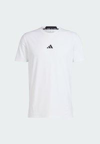 White cotton t-shirt with short sleeves, round neck, featuring a black Adidas logo on the chest. Smooth texture, standard fit.