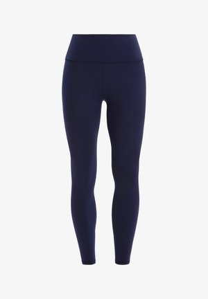 Marineblaue Leggings aus dehnbarem Stoff, mit hohem Taillenbund und glatter Textur, die für Komfort und Flexibilität entwickelt wurden.