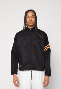 veste adidas noir et orange