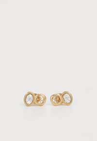 Boucles d'oreilles en ton or avec des cristaux clairs ovales, présentant des designs découpés complexes et une finition lisse et brillante.