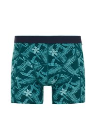 Herrboxershorts i mörk teal tyg med ett mönster av ljusblåa ormbunkar och blommor, med en enfärgad marinblå midjeresår och en mjuk textur.
