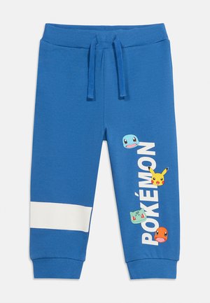 Blue children's sweatpants with white stripe on left leg, Pokemon characters Squirtle, Pikachu, Bulbasaur, Charmander, and vertical "POKÉMON" text on right leg.